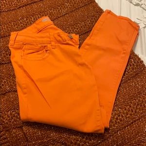 Coral orange rockstar skinny jeans